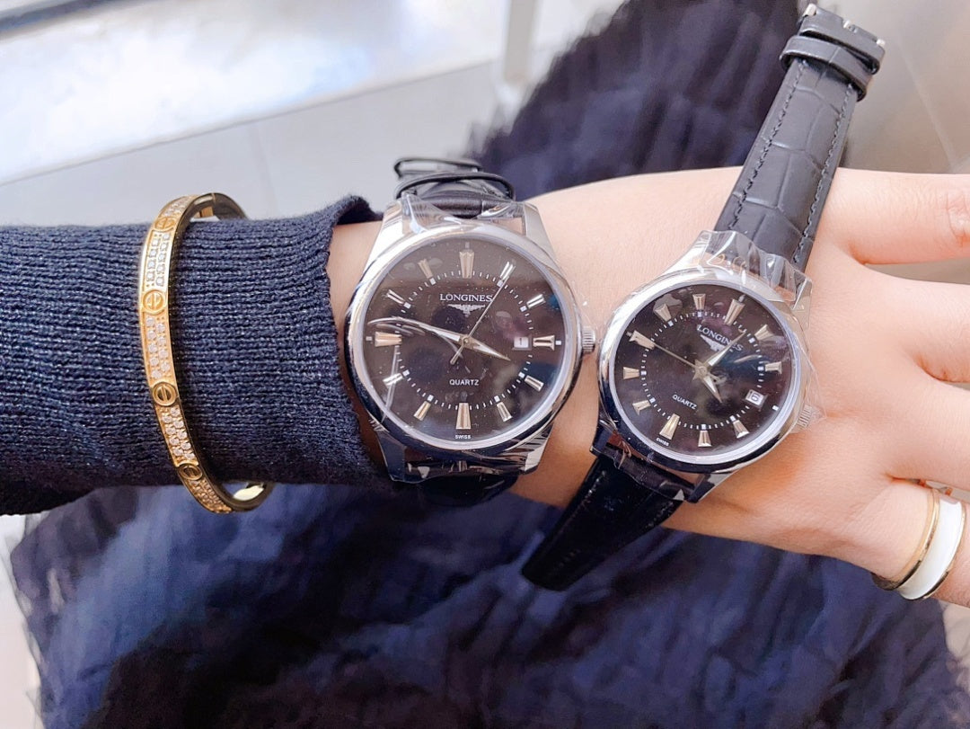 Longines watch pair with dark dials, silver and gold cases, on brown straps.