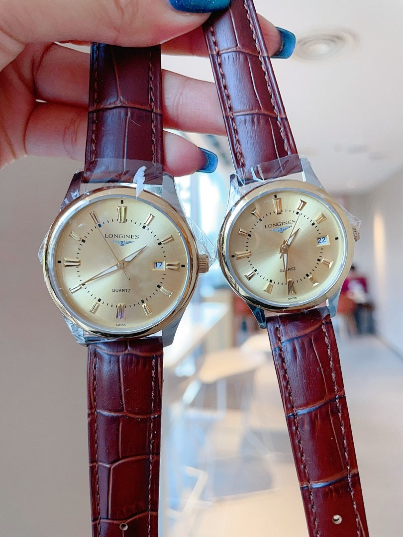 Longines watch pair with cream dials and burgundy leather straps, held up.