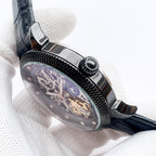 Watch side view with textured bezel and crown, blue-toned dial under glass