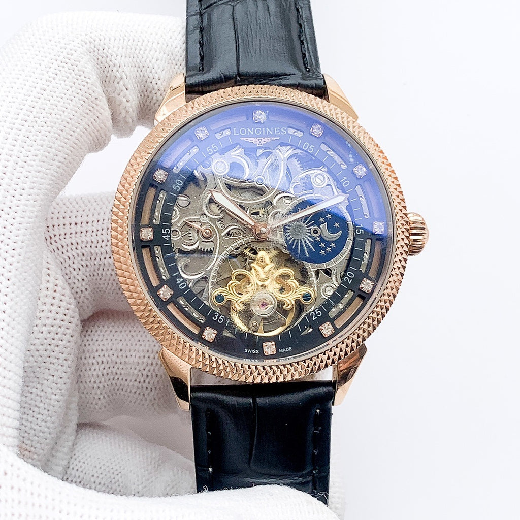 Rose-gold tone skeleton watch with black leather strap and blue moon phase dial