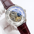 Skeleton watch with dark red-brown leather strap, silver case, blue moon phase dial