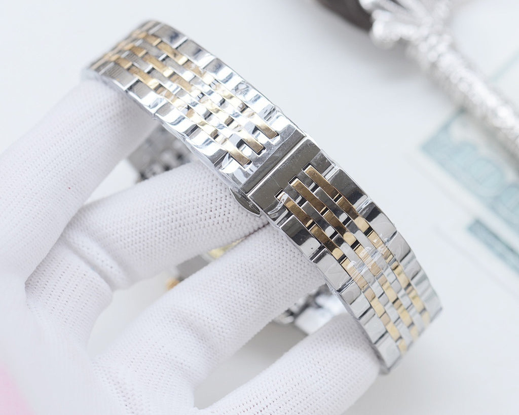 Two-tone Longines wristwatch from side view, showing metal link bracelet details.