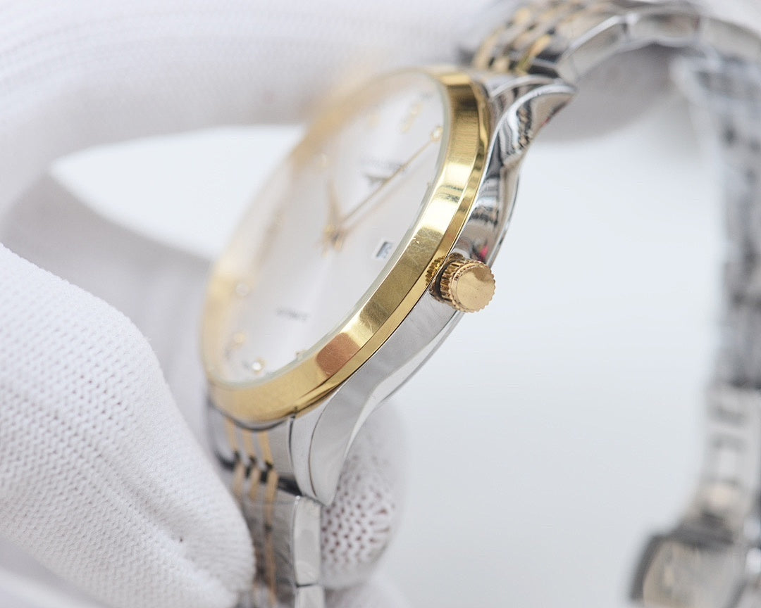 Longines wristwatch with gold-toned crown and side profile on a metal bracelet.