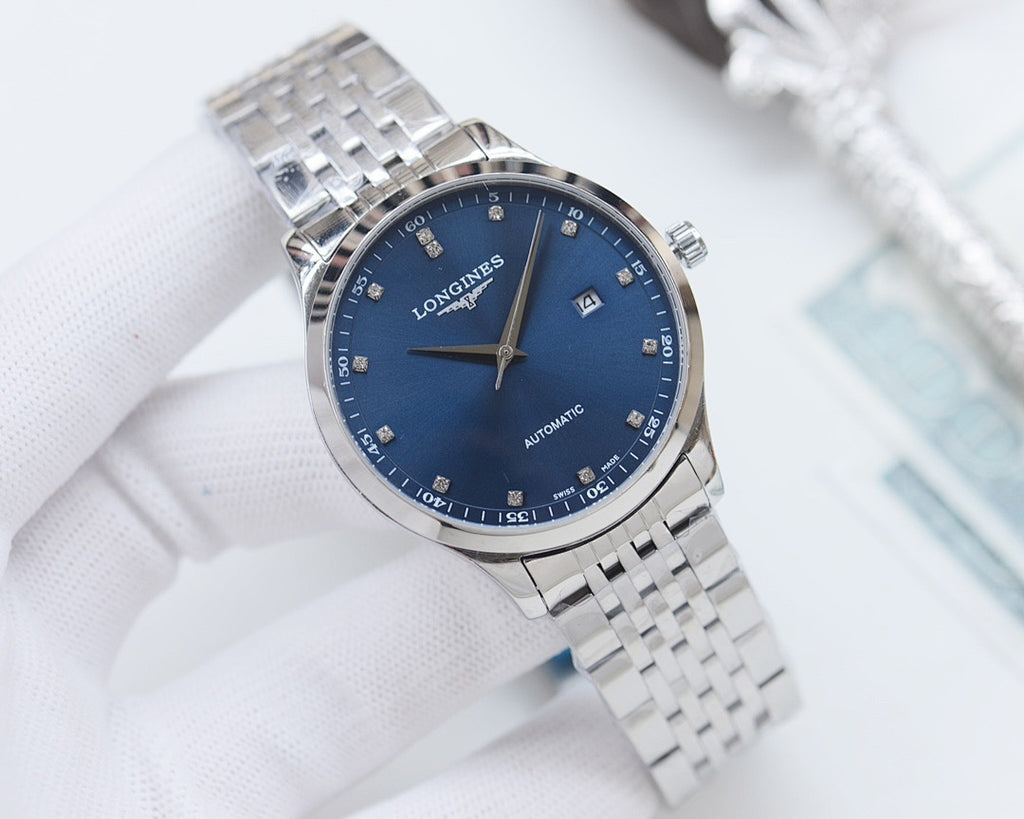 Longines wristwatch with blue dial and silver metal link bracelet, angled view.