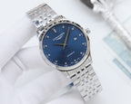 Longines wristwatch with blue dial and silver metal link bracelet, angled view.