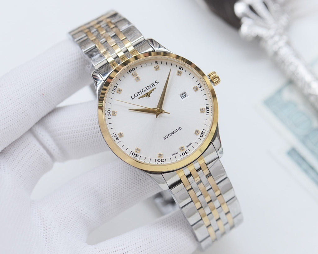 Two-tone Longines wristwatch with white dial, gold accents, and metal link bracelet.
