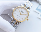 Longines wristwatch, light dial with gold-tone hands, silver-and-gold bracelet.