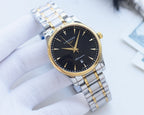 Longines wristwatch, dark dial with gold-tone bezel, silver-and-gold metal bracelet.