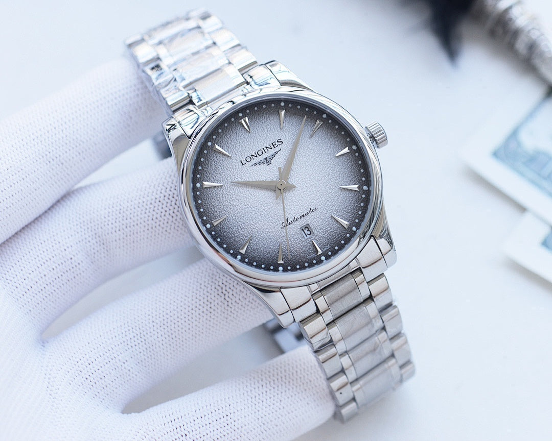 Longines wristwatch, dark dial, silver case, linked metal bracelet with crown.