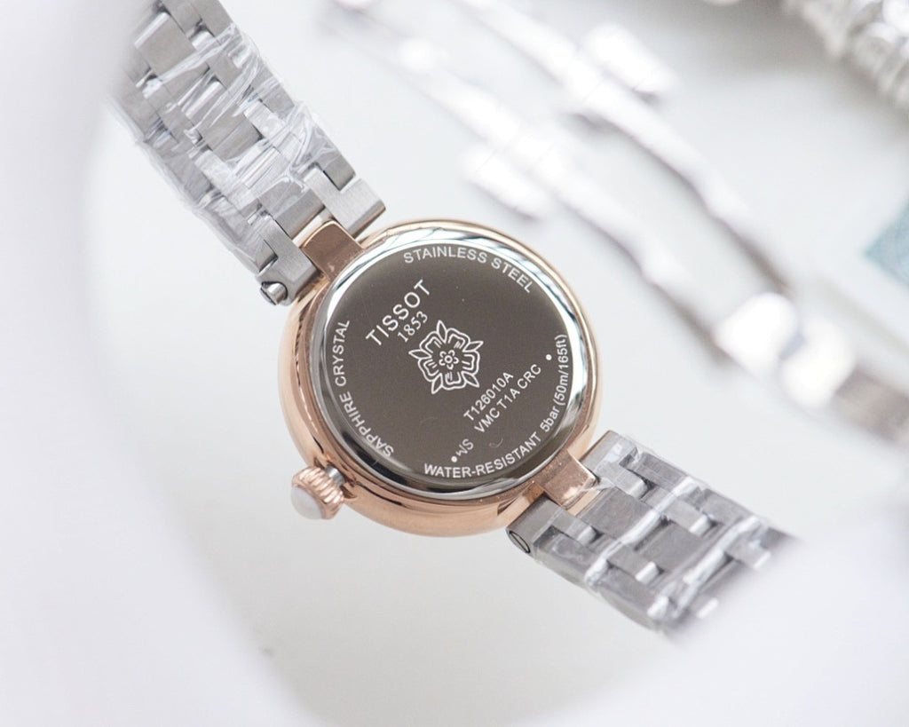 Stainless-steel watch case back with engraved markings and water-resistant text