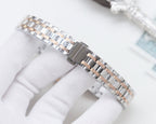 Two-tone metal mesh watch bracelet with rose-gold links and clasp