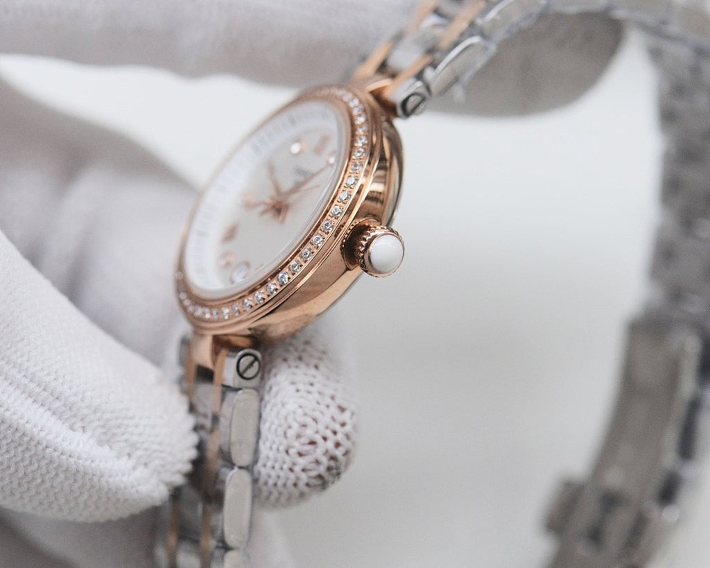 Rose-gold Longines watch with white dial and diamond bezel detailing