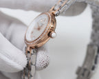 Rose-gold Longines watch with white dial and diamond bezel detailing