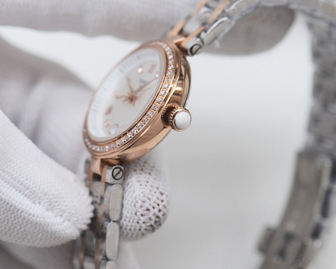 Rose-gold Longines watch with white dial and diamond bezel detailing