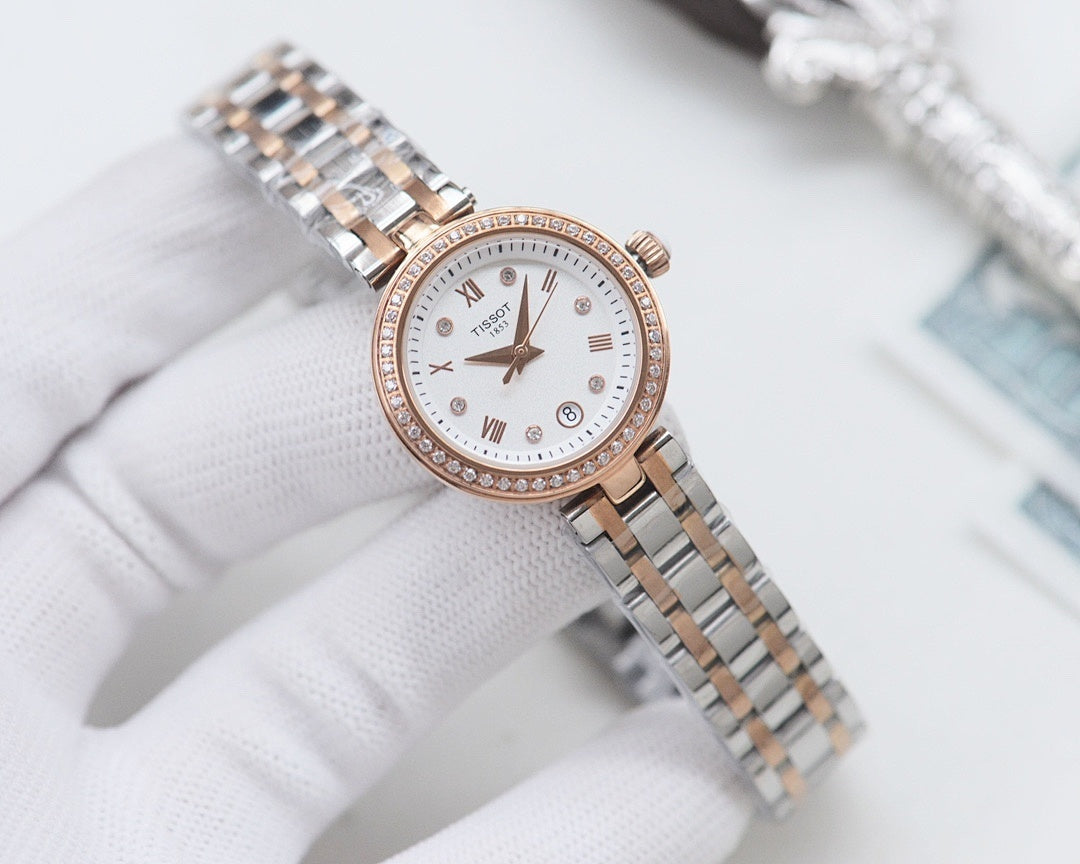 Two-tone Longines watch with white dial, roman numerals, and crystal-studded bezel