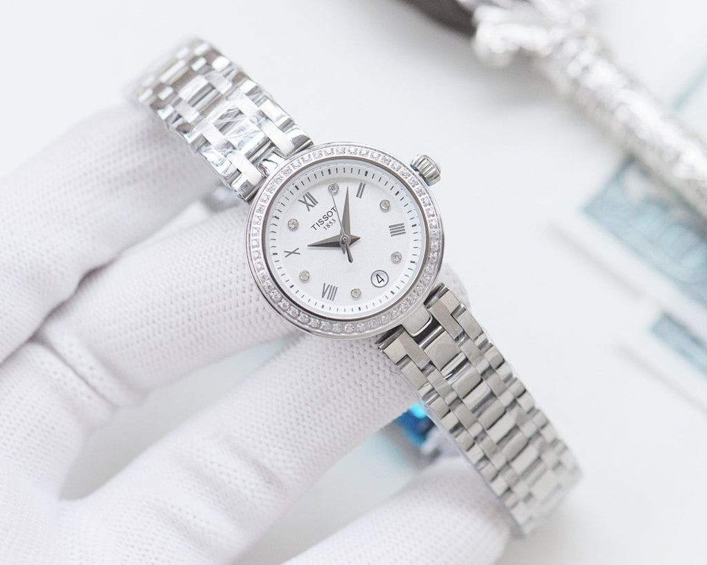 Silver Longines watch with white dial, roman numerals, and metal bracelet