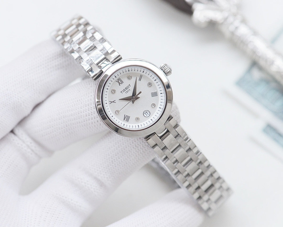 Silver Longines watch with white dial and metal mesh bracelet, angled view