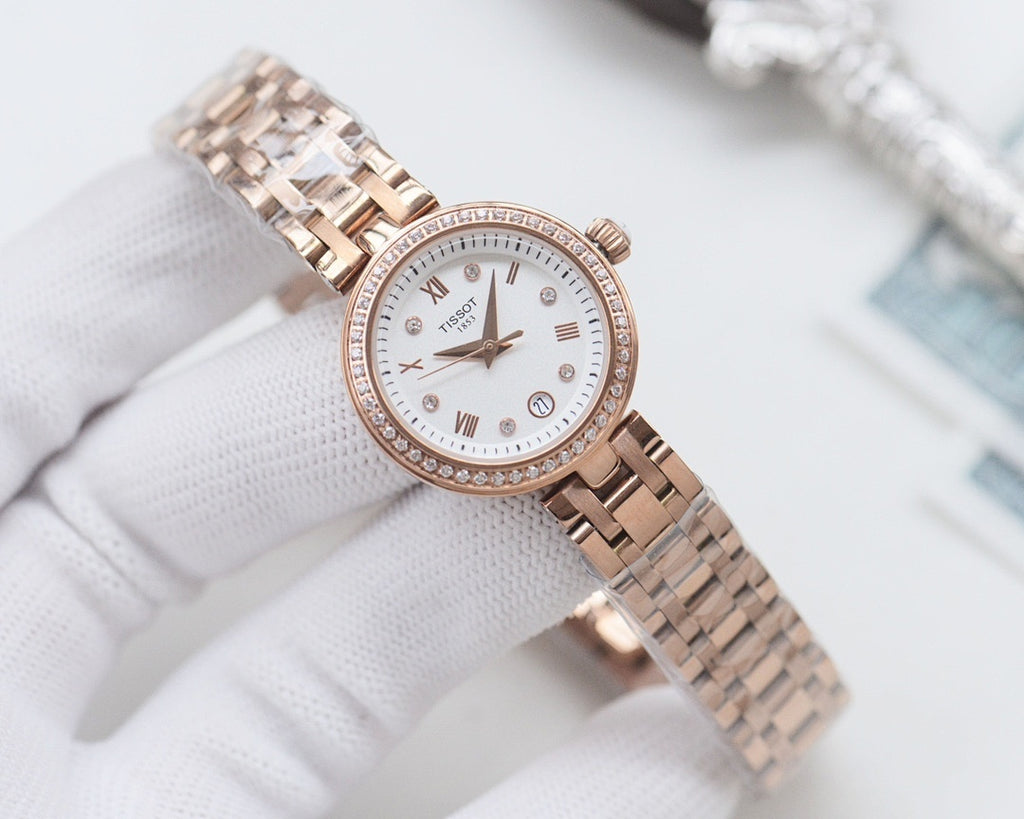 Rose-gold Longines watch with white dial, roman numerals, and metal mesh bracelet