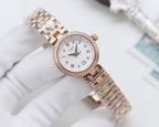 Rose-gold Longines watch with white dial, roman numerals, and metal mesh bracelet