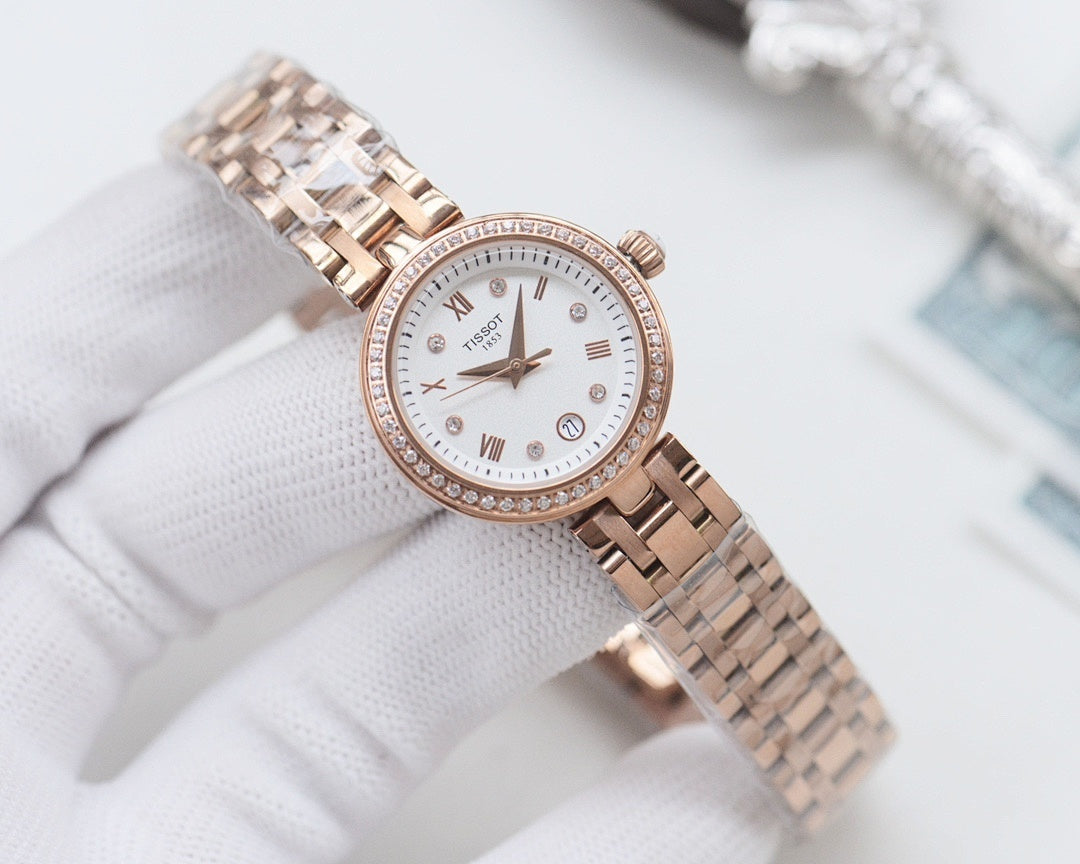 Rose-gold Longines watch with white dial, roman numerals, and metal mesh bracelet