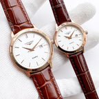 Longines quartz watch with white dial and brown leather strap, date window