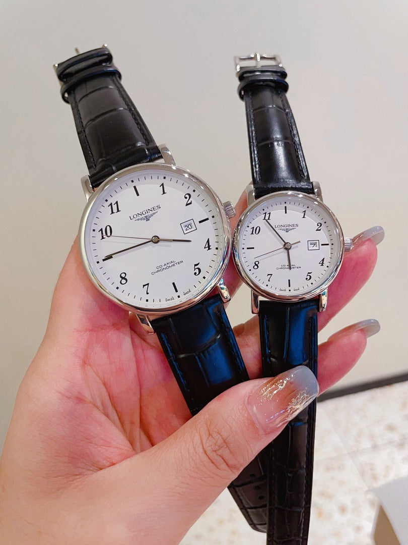 Pair of Longines watches with white dials, black leather straps, silver-tone cases.