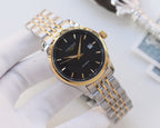 Longines wristwatch with dark dial, gold-tone hands, and linked metal bracelet