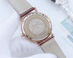 Quartz wristwatch case back with engravings, cream leather strap