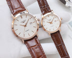 Quartz wristwatches with brown leather straps and white dials, rose-gold cases