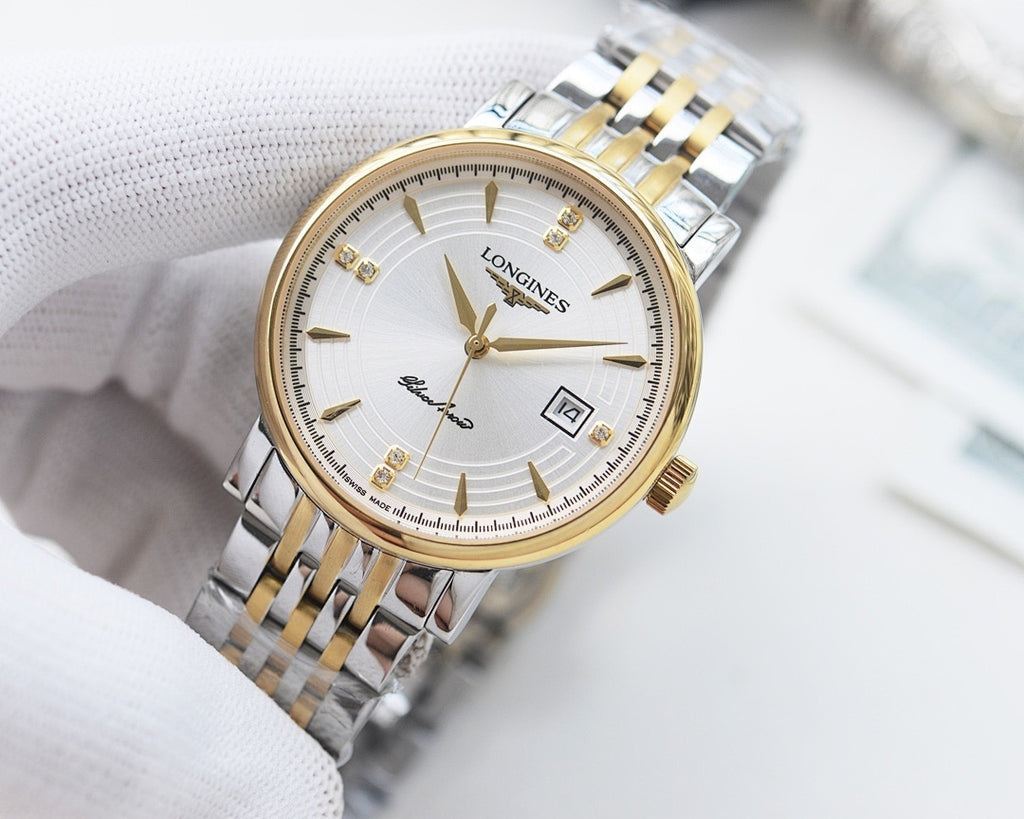 Longines wristwatch with two-tone bracelet, white dial, gold hands, and hour markers.