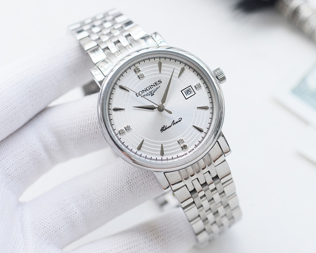 Longines wristwatch with silver-tone bracelet, white dial, gold hands and hour markers.