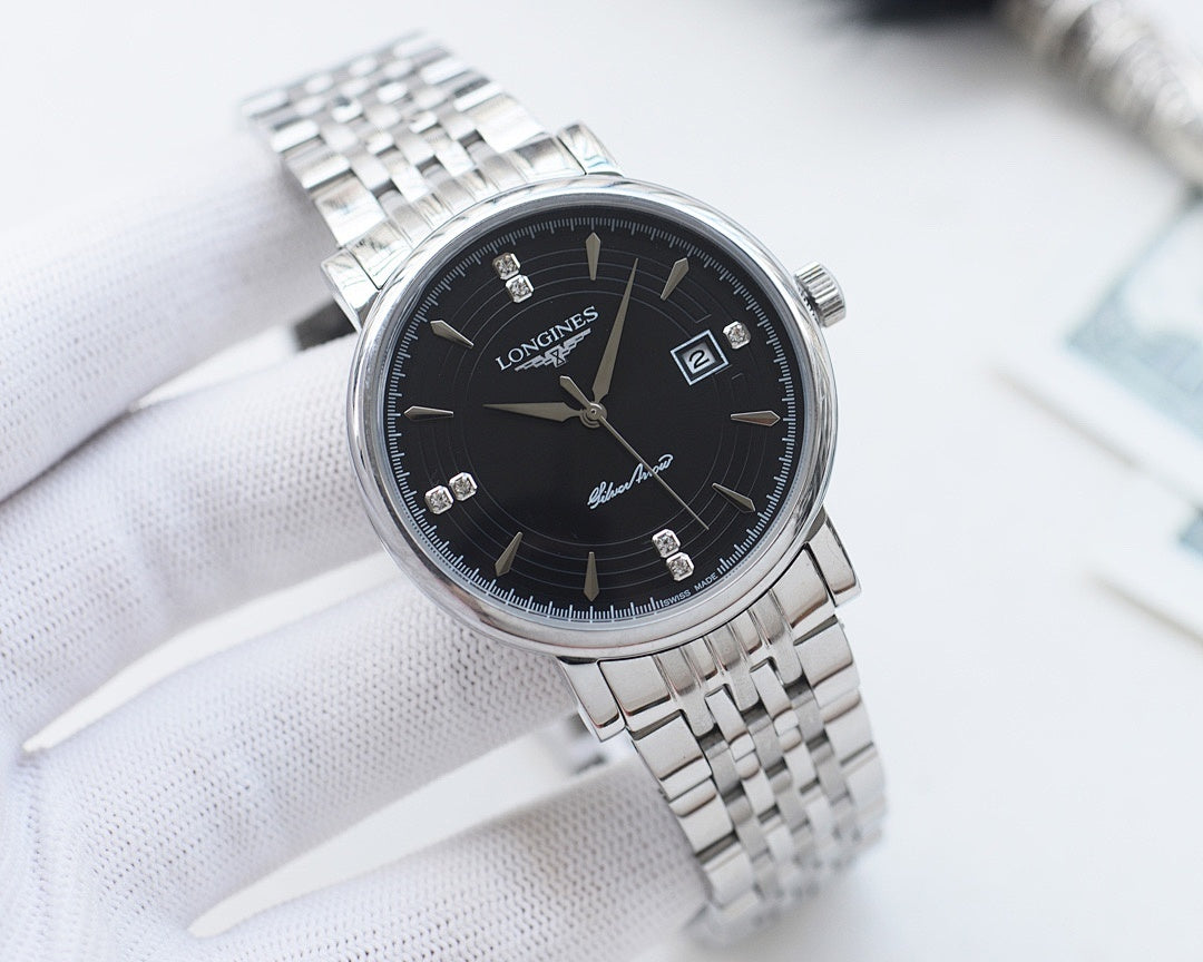 Longines wristwatch with silver-tone metal bracelet, dark dial, gold hands and markers.
