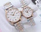 Longines watch pair with two-tone metal bracelet and white dial