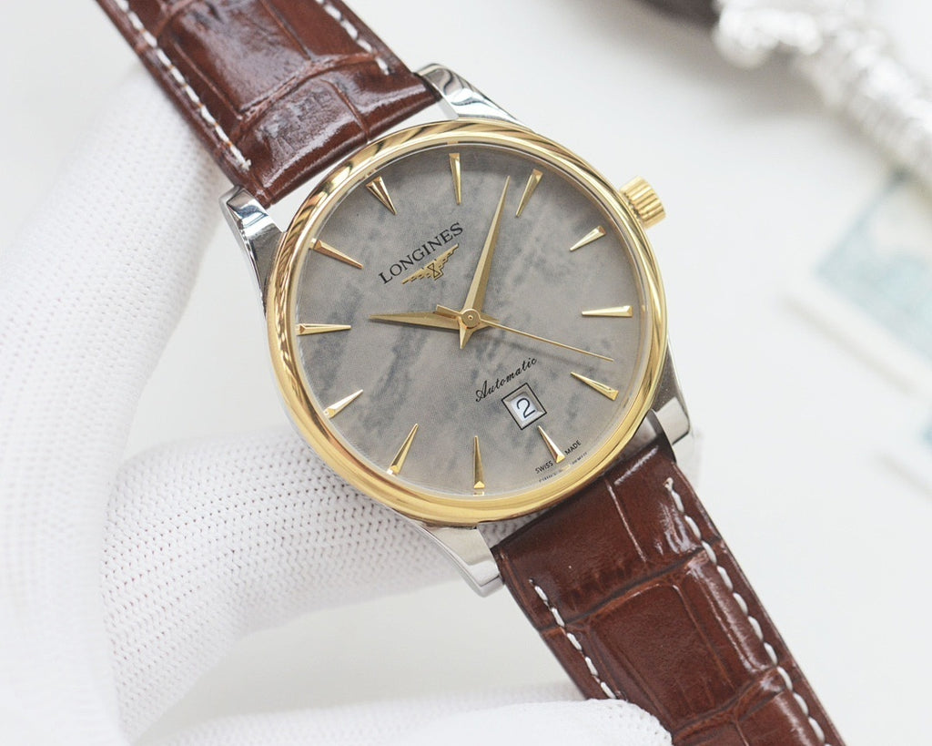 Longines wrist watch with gold-tone case, gray dial, brown leather strap.