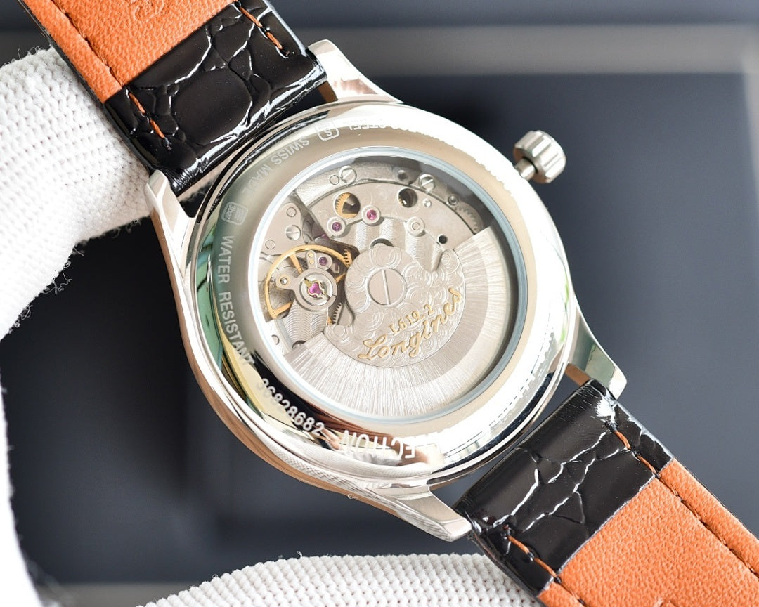 Automatic wristwatch caseback, silver movement view, orange leather strap, round screw-in back