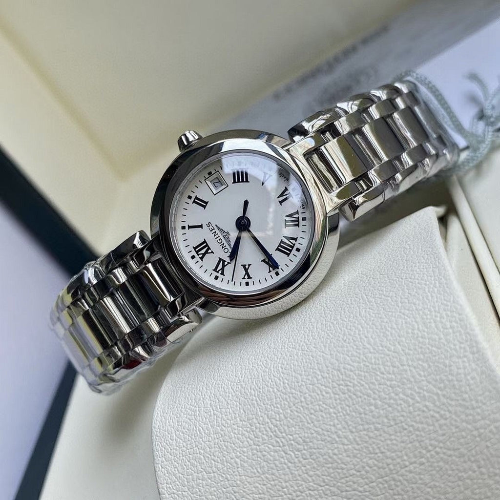 Longines watch close-up with white Roman numeral dial and polished stainless steel bracelet