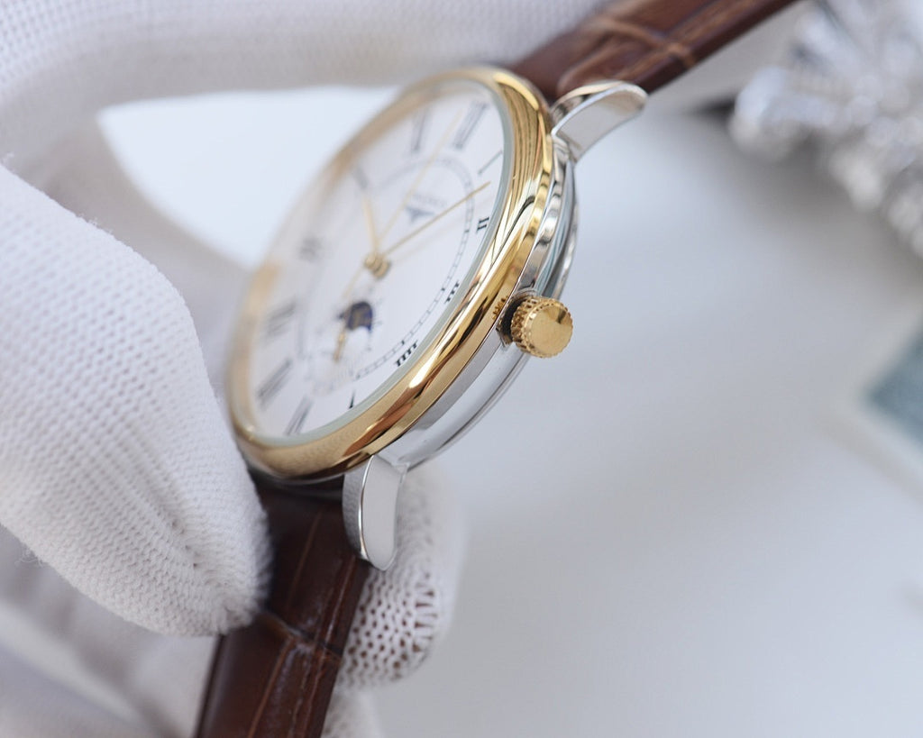 Analog wristwatch, brown leather strap, gold-tone crown and case, partial dial view