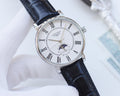 Longines watch, navy leather strap, silver round case, Roman numeral dial