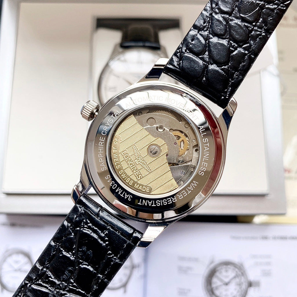 Automatic watch with exposed movement, black leather strap and gold-toned case