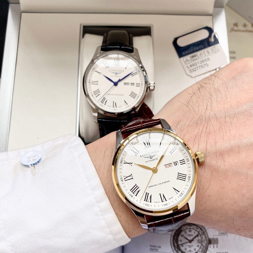 Automatic watch with white dial, gold-toned case and black leather strap, date window