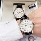 Automatic watch with white dial, blue hands, black leather strap and date window