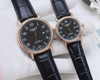 Longines watch set with rose-gold-tone cases, black dials, dark leather straps.