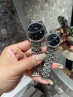 Pair of Longines quartz wristwatches, dark blue dials, steel link bracelet