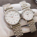 Longines quartz wristwatches with white dials and silver-tone link metal bracelets, two-pack