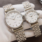 Longines quartz wristwatches with white dials and silver-tone link metal bracelets, two-pack