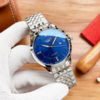 Longines automatic watch with blue dial and silver link bracelet