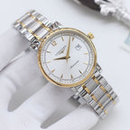 Longines two-tone watch with gold-tone bezel and silver bracelet, white dial