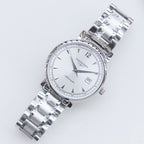 Longines stainless steel watch with silver bracelet and white dial, wristwatch face