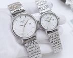 Two Tissot watches with silver stainless steel bracelets and white round dials