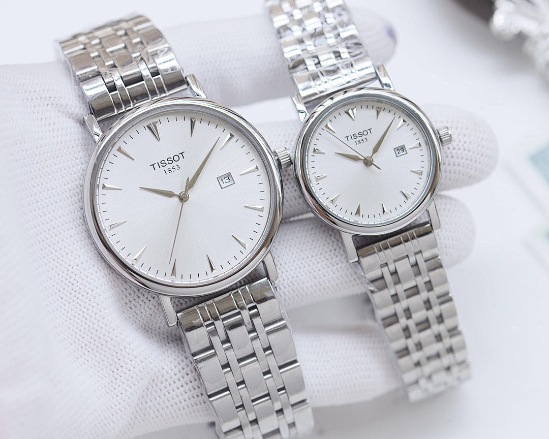 Two Tissot watches with silver stainless steel bracelets and white round dials
